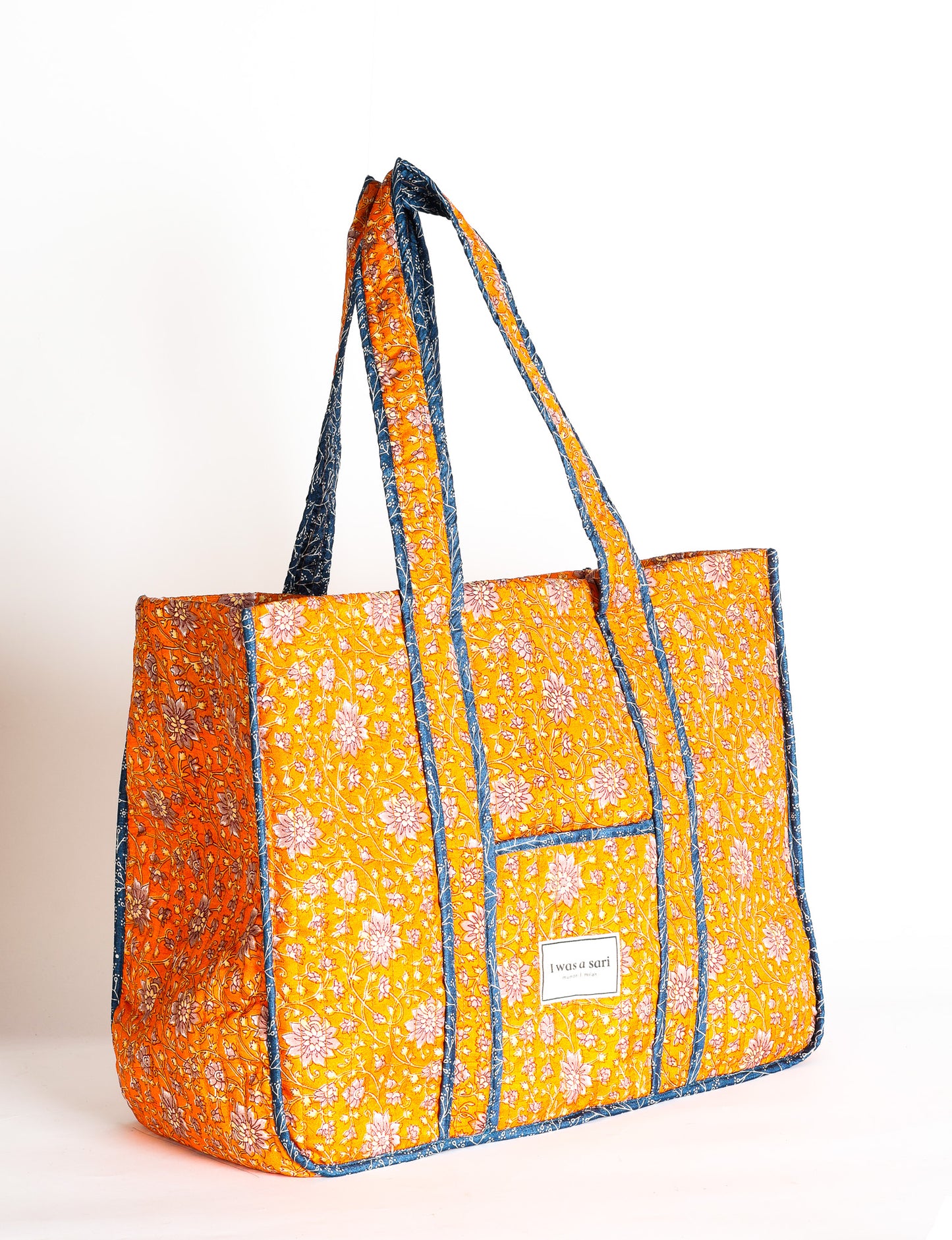 Quilted work tote bag with structured rectangular design and long shoulder straps, representing slow fashion and ethical clothing ideals, made as part of upcycled women's clothing and sustainable women's clothing using recycled fashion and earth friendly clothing practices.
