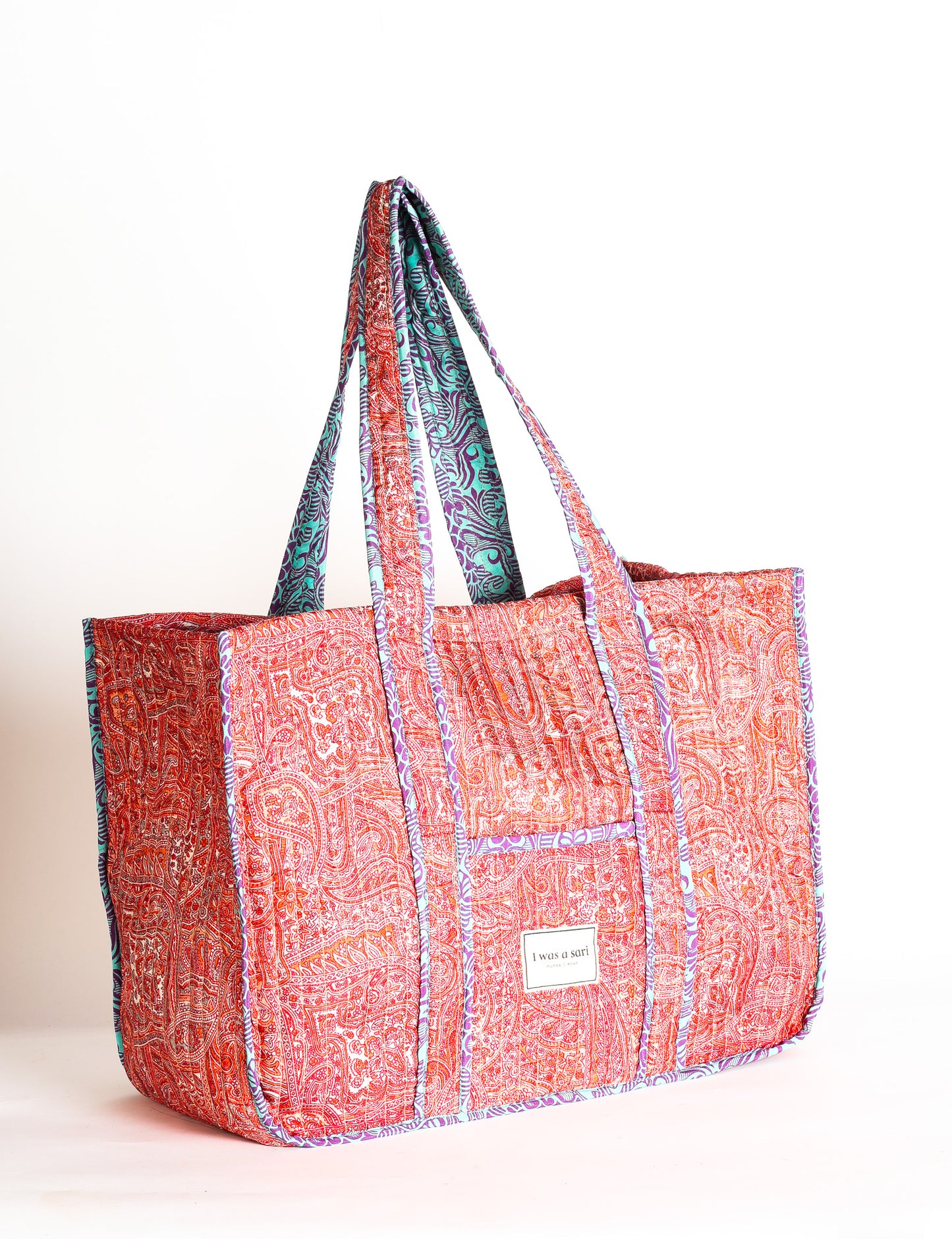 Quilted work tote bag with structured rectangular design and long shoulder straps, representing slow fashion and ethical clothing ideals, made as part of upcycled women's clothing and sustainable women's clothing using recycled fashion and earth friendly clothing practices.