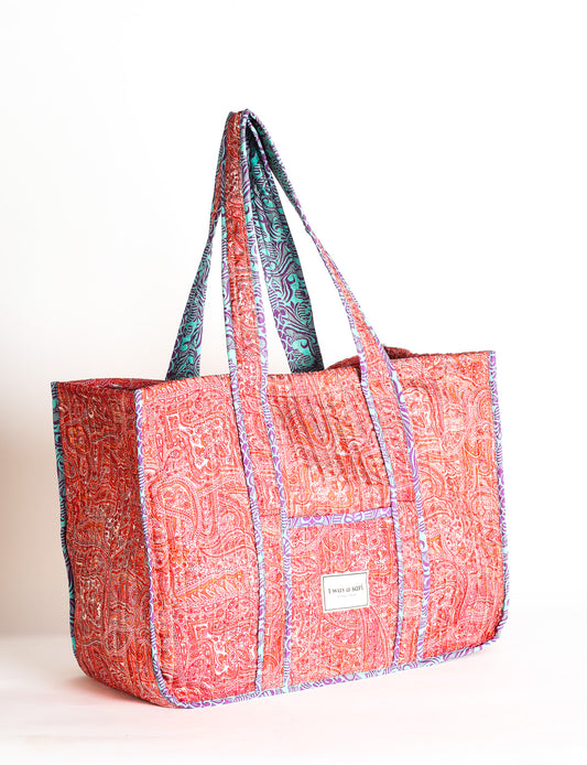 Quilted work tote bag with structured rectangular design and long shoulder straps, representing slow fashion and ethical clothing ideals, made as part of upcycled women's clothing and sustainable women's clothing using recycled fashion and earth friendly clothing practices.