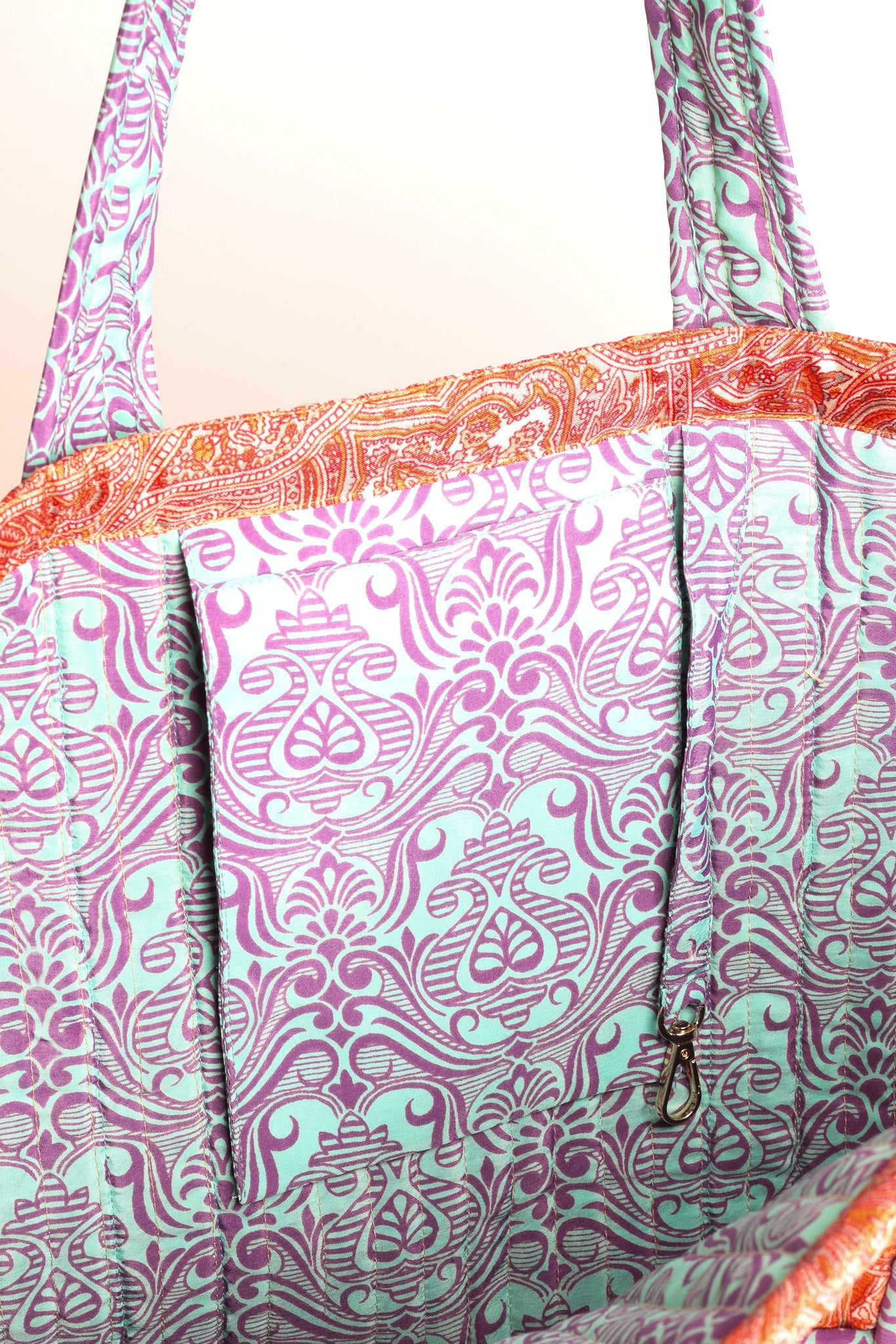 Quilted work tote bag with structured rectangular design and long shoulder straps, representing slow fashion and ethical clothing ideals, made as part of upcycled women's clothing and sustainable women's clothing using recycled fashion and earth friendly clothing practices.