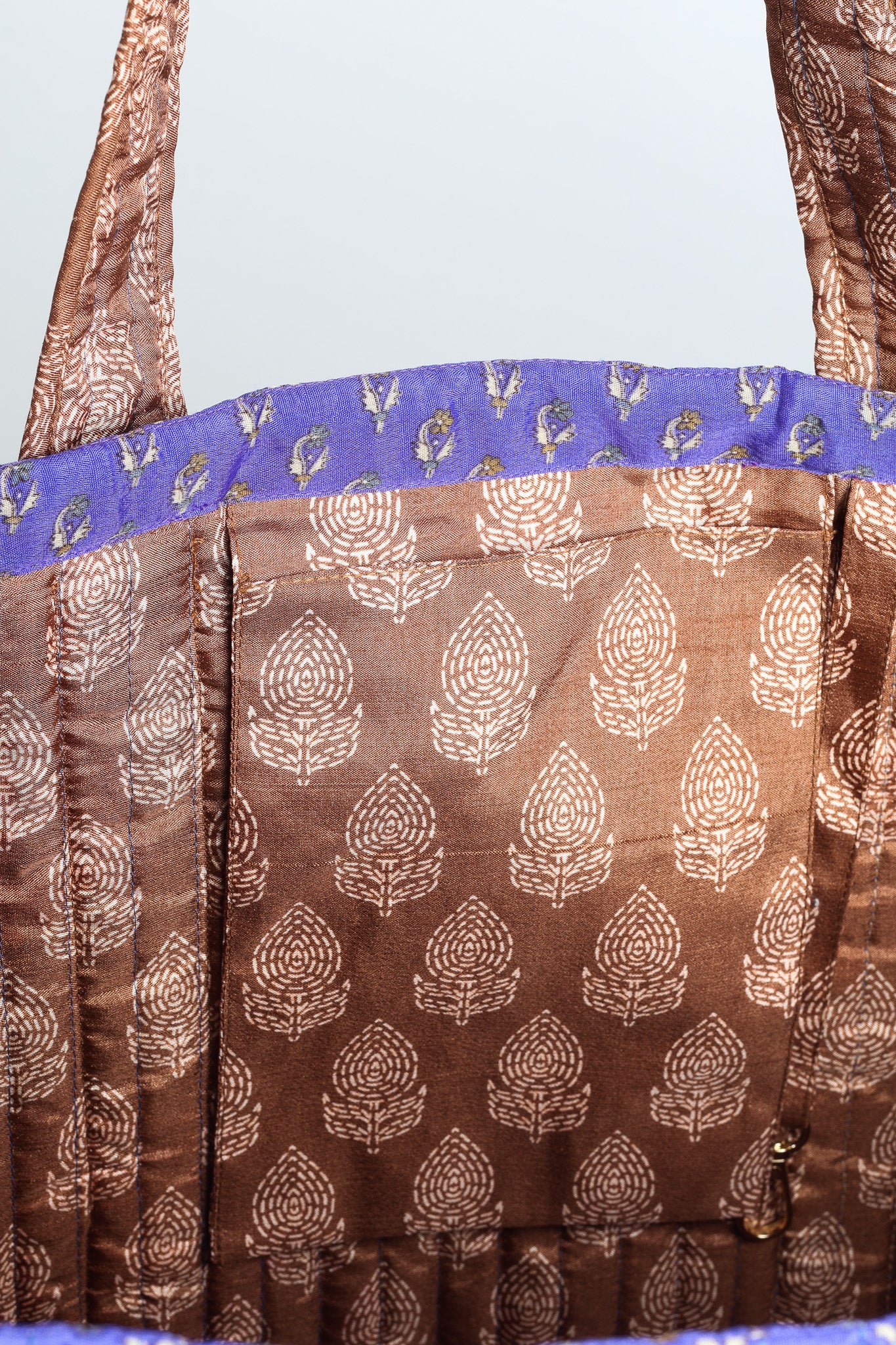 Quilted work tote bag with structured rectangular design and long shoulder straps, representing slow fashion and ethical clothing ideals, made as part of upcycled women's clothing and sustainable women's clothing using recycled fashion and earth friendly clothing practices.