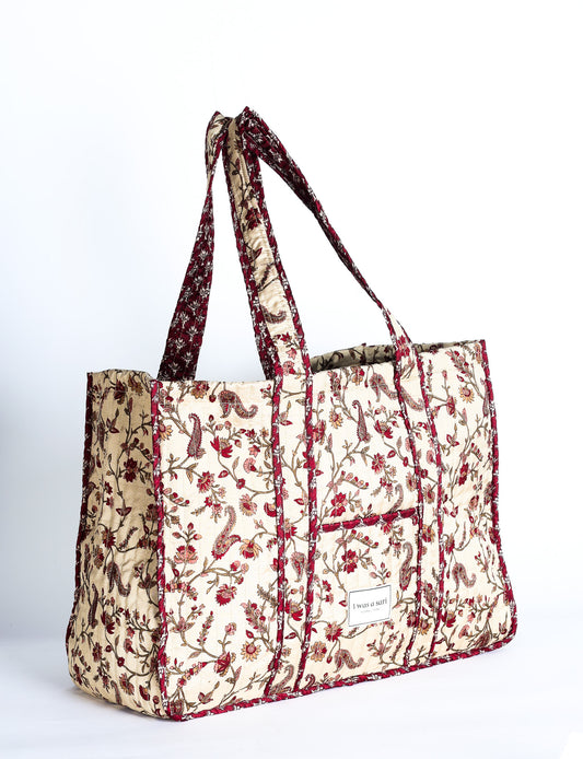 Quilted work tote bag with structured rectangular design and long shoulder straps, representing slow fashion and ethical clothing ideals, made as part of upcycled women's clothing and sustainable women's clothing using recycled fashion and earth friendly clothing practices.