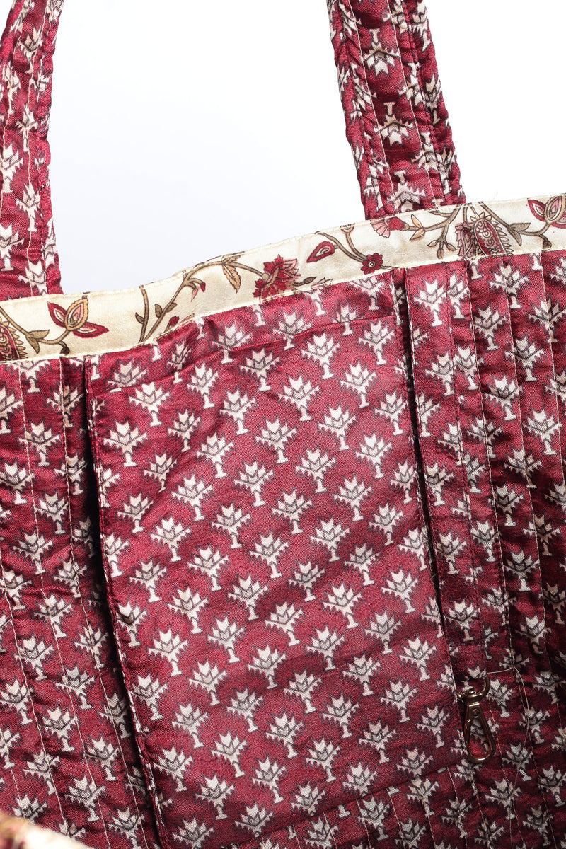 Quilted work tote bag with structured rectangular design and long shoulder straps, representing slow fashion and ethical clothing ideals, made as part of upcycled women's clothing and sustainable women's clothing using recycled fashion and earth friendly clothing practices.
