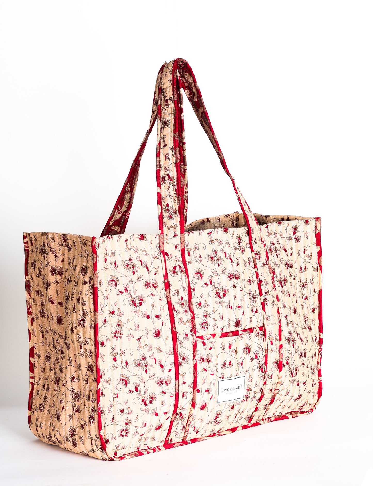 Quilted work tote bag with structured rectangular design and long shoulder straps, representing slow fashion and ethical clothing ideals, made as part of upcycled women's clothing and sustainable women's clothing using recycled fashion and earth friendly clothing practices.
