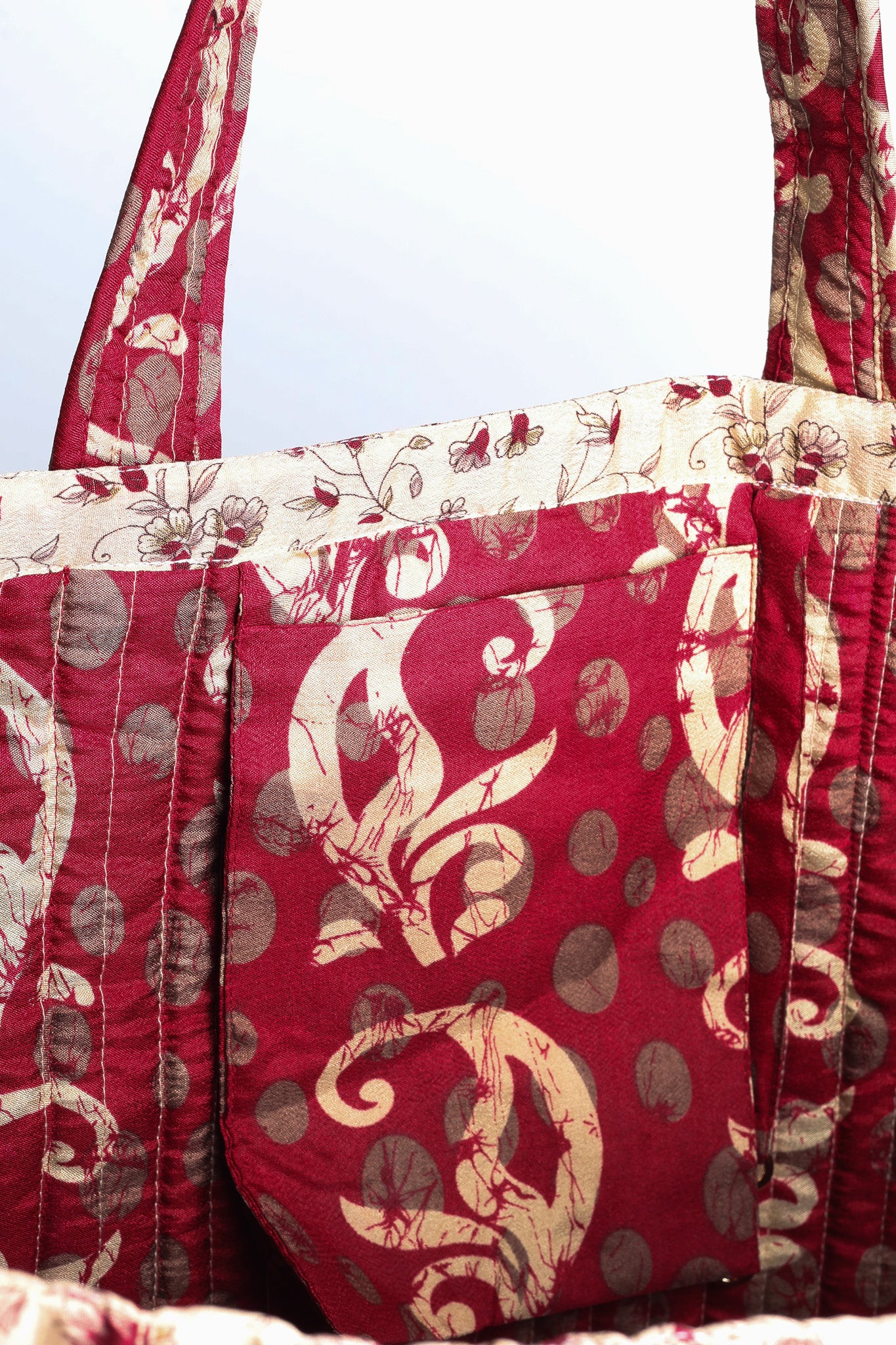 Quilted work tote bag with structured rectangular design and long shoulder straps, representing slow fashion and ethical clothing ideals, made as part of upcycled women's clothing and sustainable women's clothing using recycled fashion and earth friendly clothing practices.
