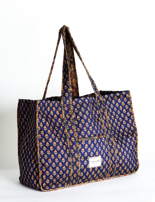 Quilted work tote bag with structured rectangular design and long shoulder straps, representing slow fashion and ethical clothing ideals, made as part of upcycled women's clothing and sustainable women's clothing using recycled fashion and earth friendly clothing practices.