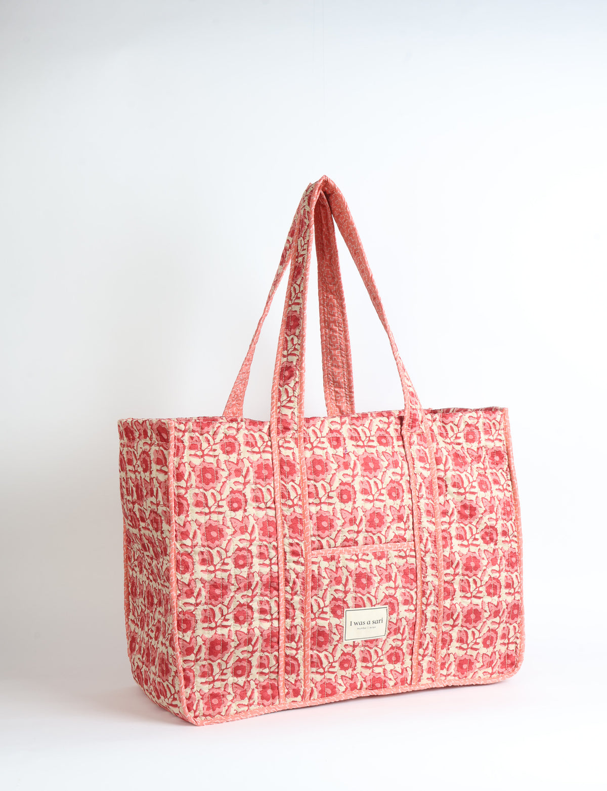 Quilted work tote bag with structured rectangular design and long shoulder straps, representing slow fashion and ethical clothing ideals, made as part of upcycled women's clothing and sustainable women's clothing using recycled fashion and earth friendly clothing practices.