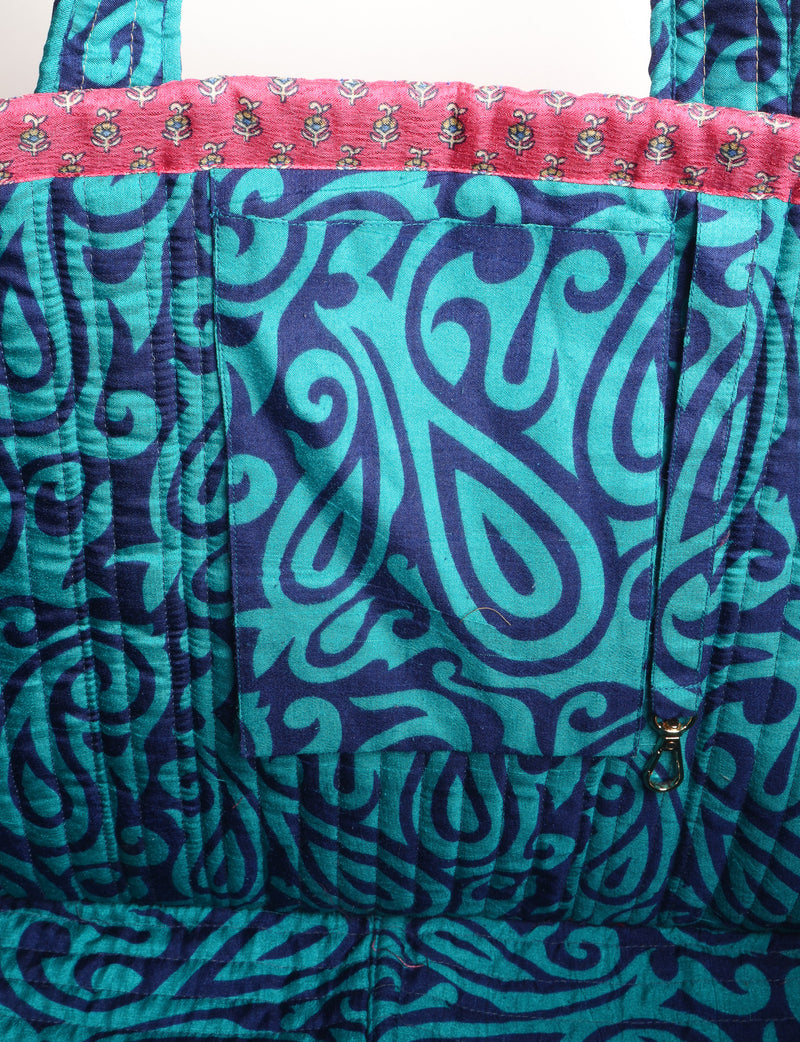 Quilted work tote bag with structured rectangular design and long shoulder straps, representing slow fashion and ethical clothing ideals, made as part of upcycled women's clothing and sustainable women's clothing using recycled fashion and earth friendly clothing practices.