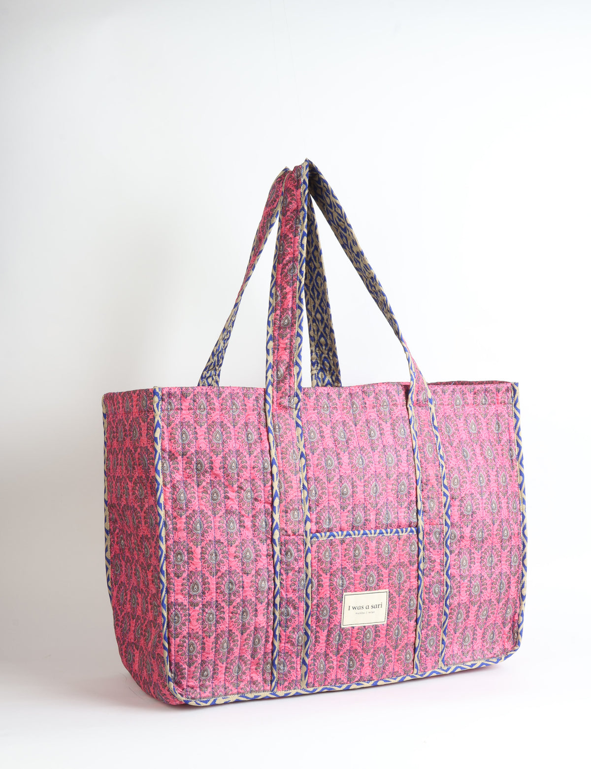 Quilted work tote bag with structured rectangular design and long shoulder straps, representing slow fashion and ethical clothing ideals, made as part of upcycled women's clothing and sustainable women's clothing using recycled fashion and earth friendly clothing practices.