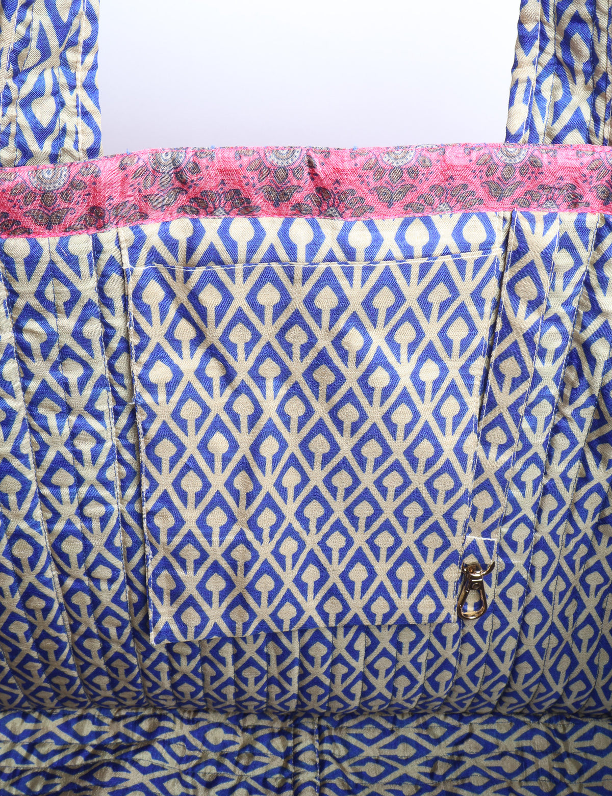 Quilted work tote bag with structured rectangular design and long shoulder straps, representing slow fashion and ethical clothing ideals, made as part of upcycled women's clothing and sustainable women's clothing using recycled fashion and earth friendly clothing practices.