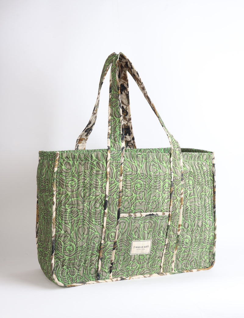 Quilted work tote bag with structured rectangular design and long shoulder straps, representing slow fashion and ethical clothing ideals, made as part of upcycled women's clothing and sustainable women's clothing using recycled fashion and earth friendly clothing practices.