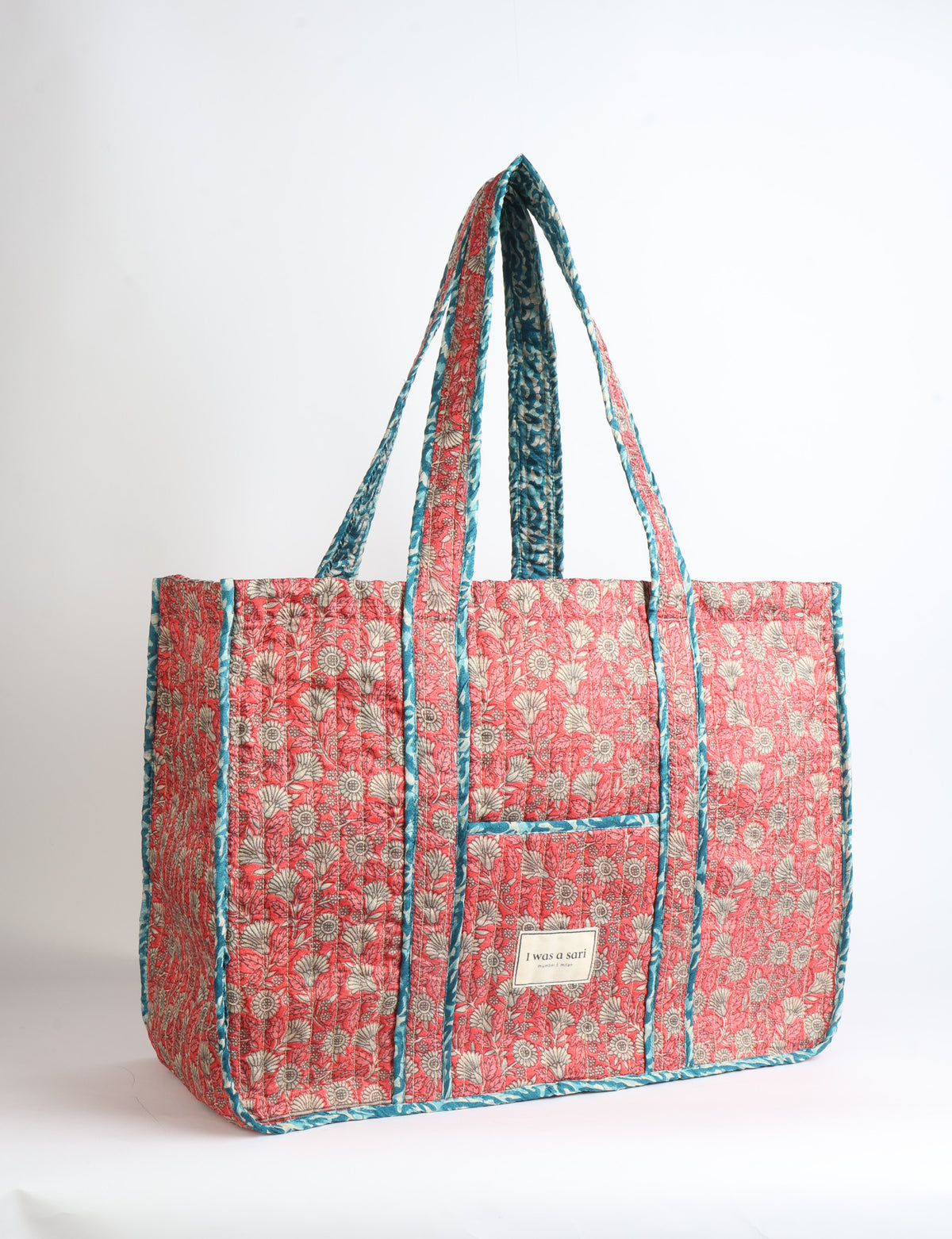Quilted work tote bag with structured rectangular design and long shoulder straps, representing slow fashion and ethical clothing ideals, made as part of upcycled women's clothing and sustainable women's clothing using recycled fashion and earth friendly clothing practices.