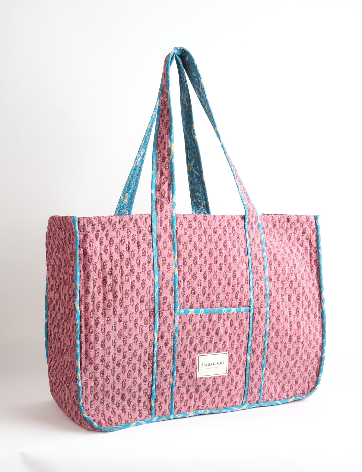 Quilted work tote bag with structured rectangular design and long shoulder straps, representing slow fashion and ethical clothing ideals, made as part of upcycled women's clothing and sustainable women's clothing using recycled fashion and earth friendly clothing practices.
