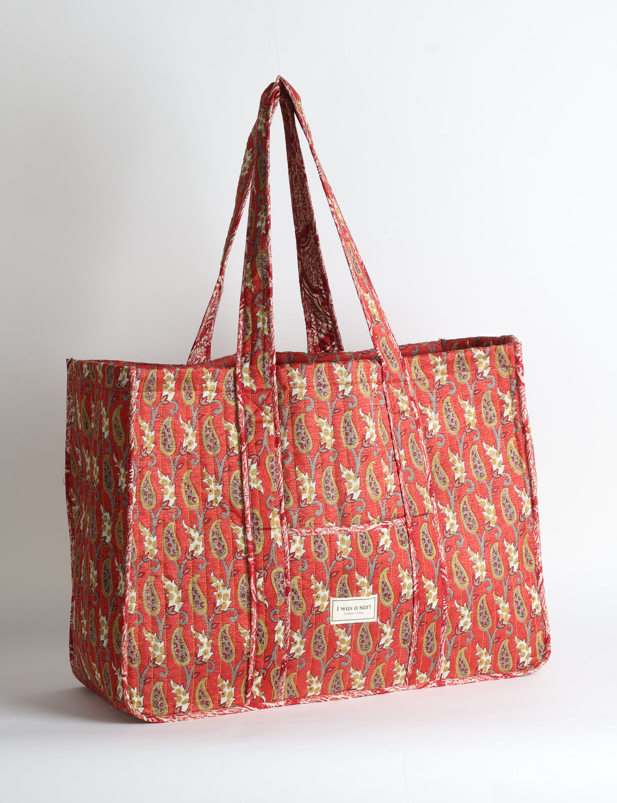 Quilted work tote bag with structured rectangular design and long shoulder straps, representing slow fashion and ethical clothing ideals, made as part of upcycled women's clothing and sustainable women's clothing using recycled fashion and earth friendly clothing practices.