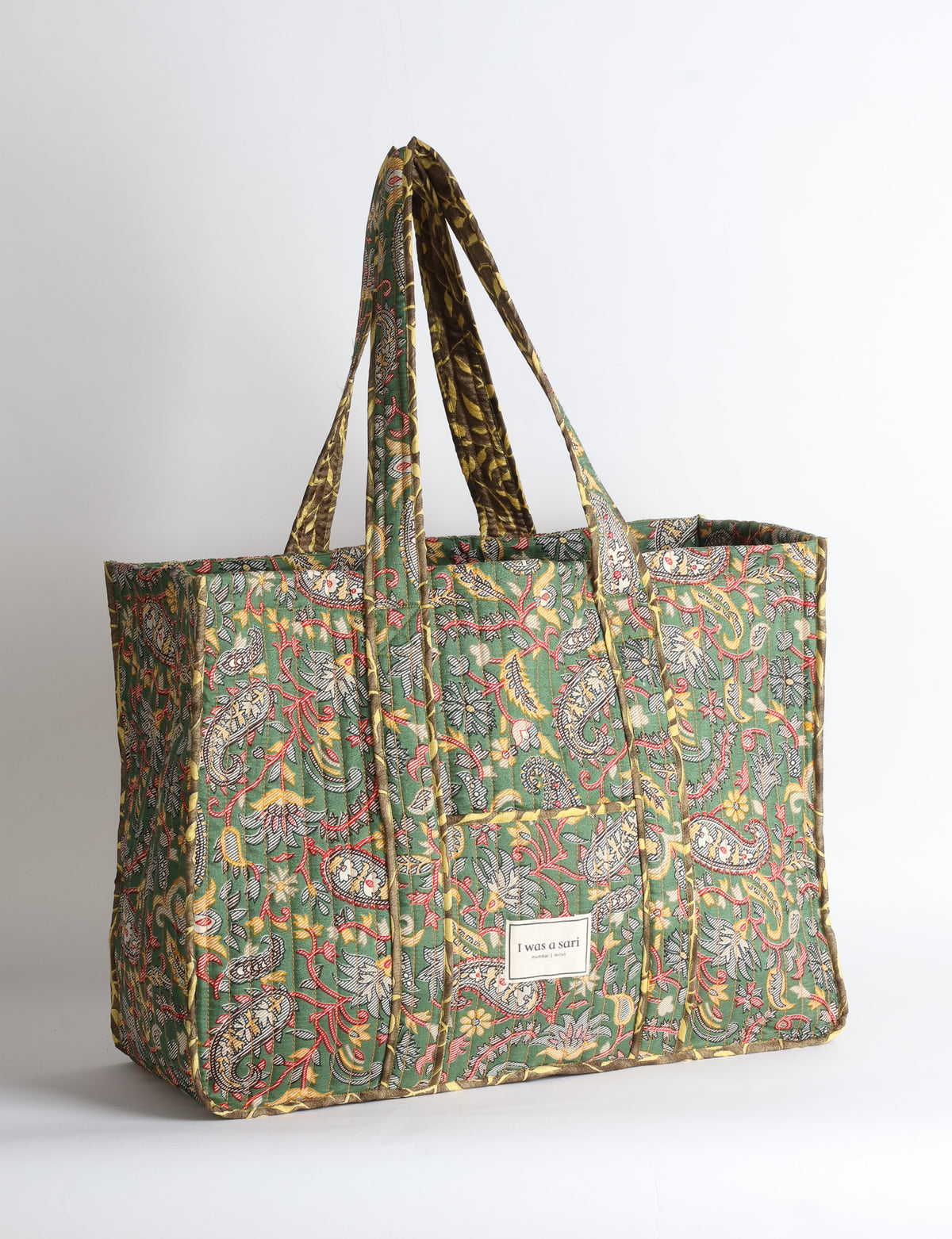 Quilted work tote bag with structured rectangular design and long shoulder straps, representing slow fashion and ethical clothing ideals, made as part of upcycled women's clothing and sustainable women's clothing using recycled fashion and earth friendly clothing practices.