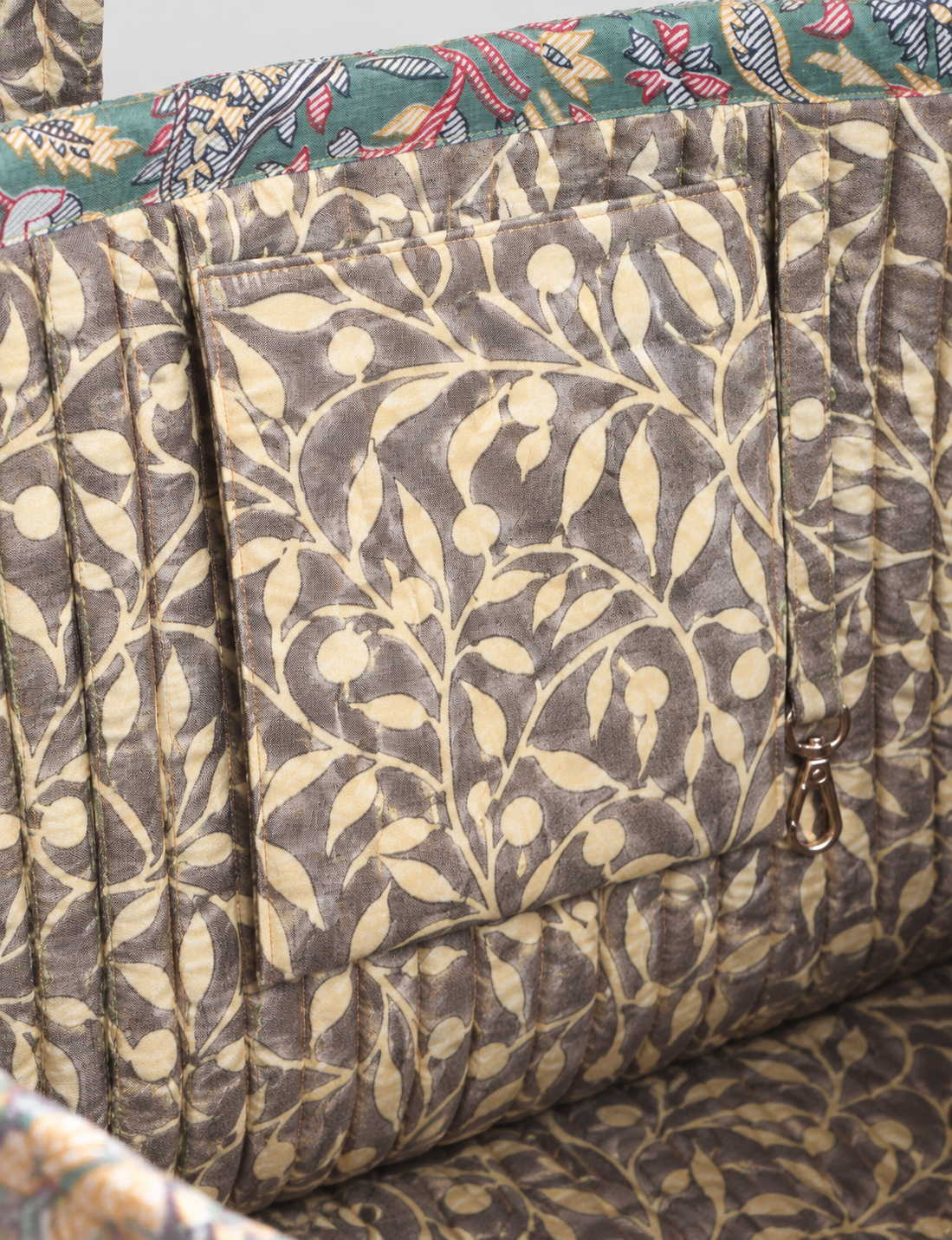 Quilted work tote bag with structured rectangular design and long shoulder straps, representing slow fashion and ethical clothing ideals, made as part of upcycled women's clothing and sustainable women's clothing using recycled fashion and earth friendly clothing practices.
