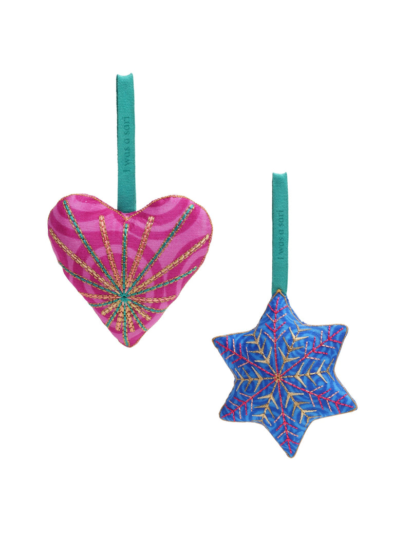 Set of two fabric Christmas ornaments, one pink heart and one blue star, both with embroidered details and teal hanging loops