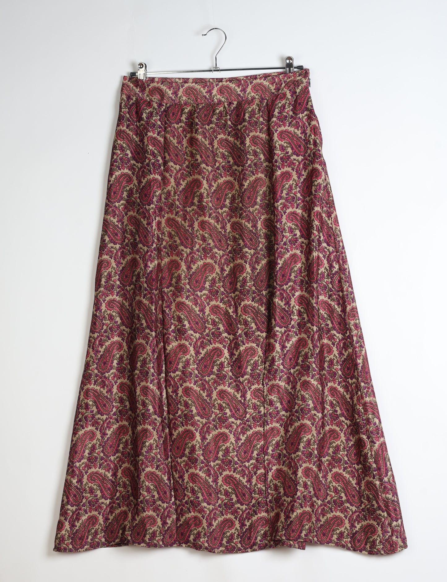 Midi A-line skirt with front slit, fitted waistband, concealed side closure, and below mid-calf length silhouette.