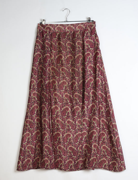 Midi A-line skirt with front slit, fitted waistband, concealed side closure, and below mid-calf length silhouette.