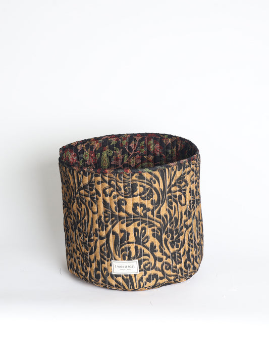 Quilted storage basket in a soft cylindrical shape, available in S, M, L, and XL sizes