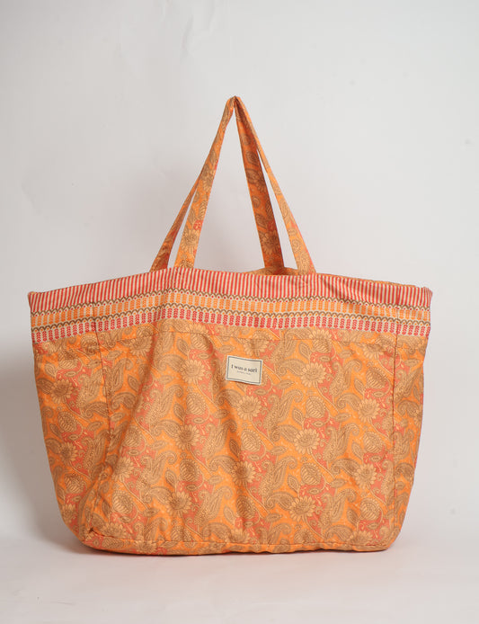 Large beach bag with a spacious rectangular design, wide top opening, and comfortable shoulder handles for carrying daily and travel essentials.