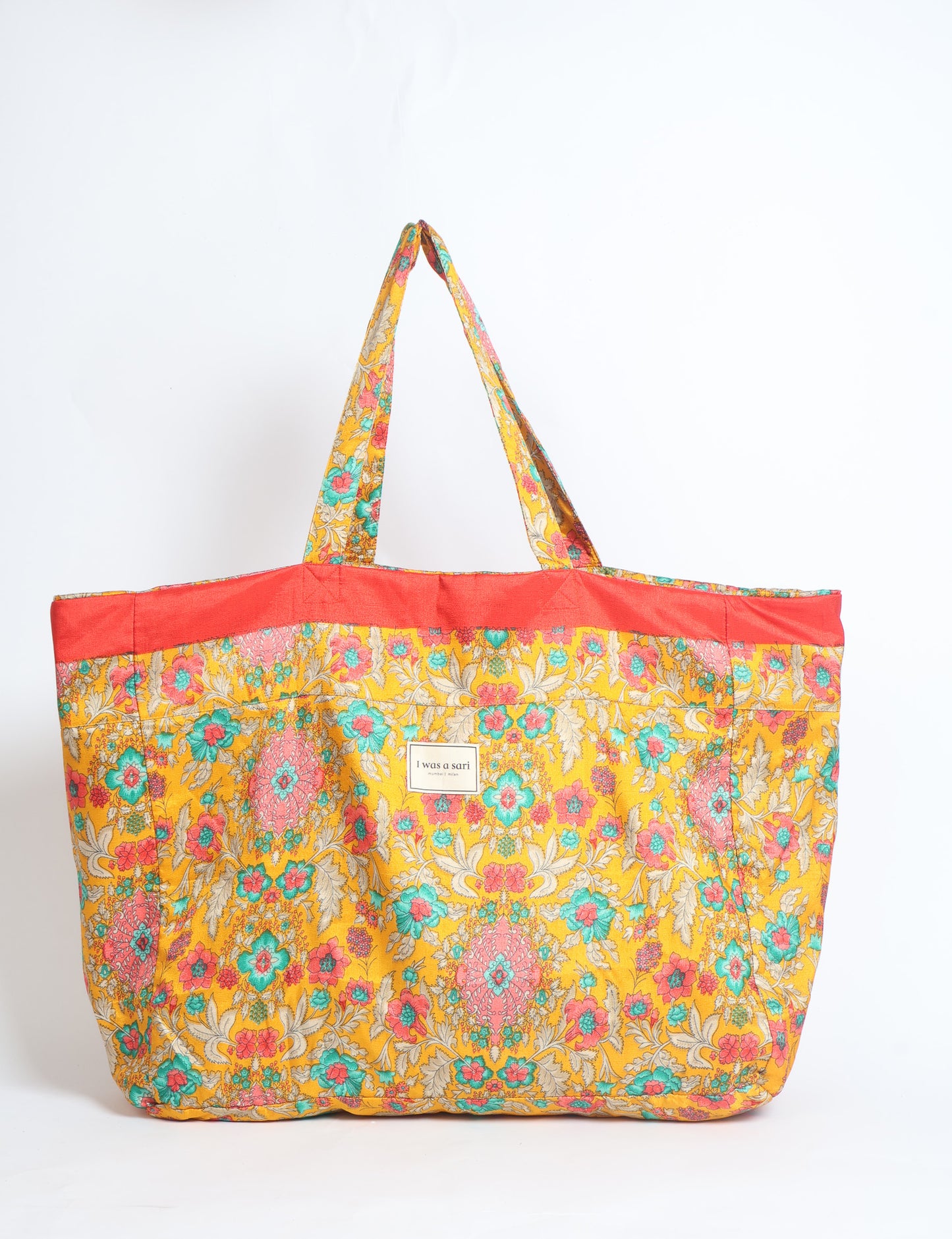 Large beach bag with a spacious rectangular design, wide top opening, and comfortable shoulder handles for carrying daily and travel essentials.