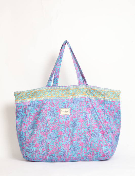 Large beach bag with a spacious rectangular design, wide top opening, and comfortable shoulder handles for carrying daily and travel essentials.