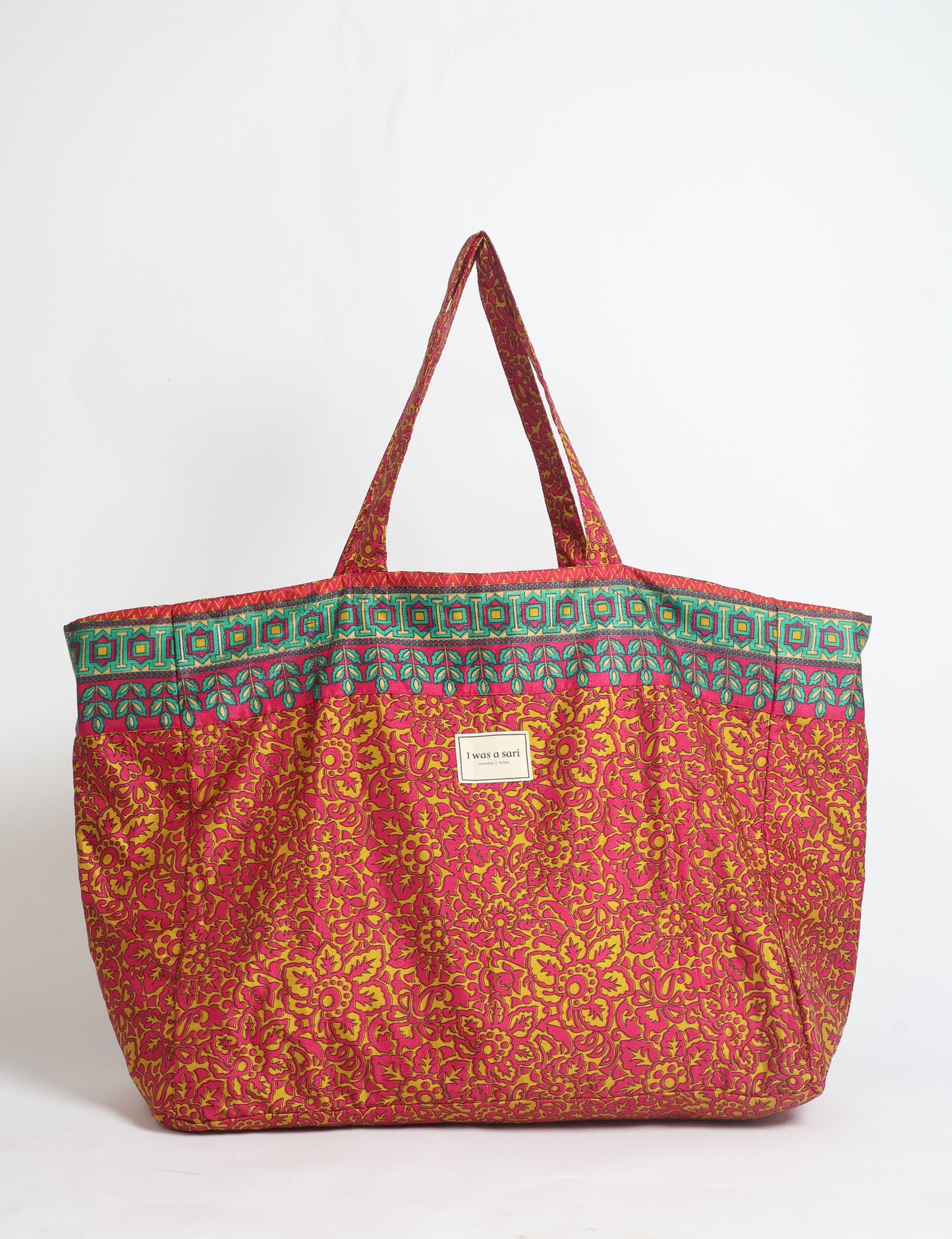 Large beach bag with a spacious rectangular design, wide top opening, and comfortable shoulder handles for carrying daily and travel essentials.