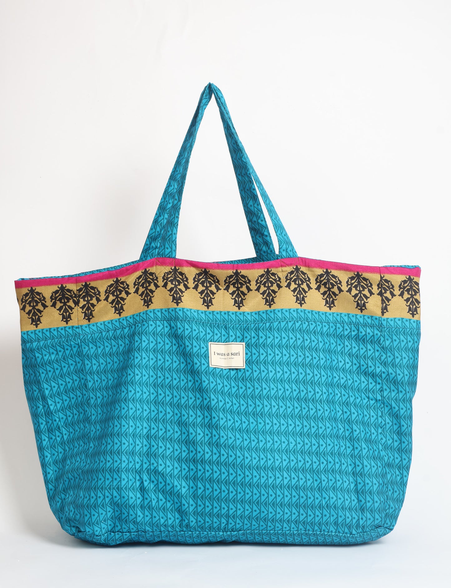 Large beach bag with a spacious rectangular design, wide top opening, and comfortable shoulder handles for carrying daily and travel essentials.