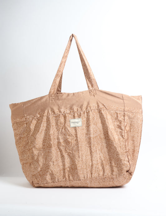 Large beach bag with a spacious rectangular design, wide top opening, and comfortable shoulder handles for carrying daily and travel essentials.