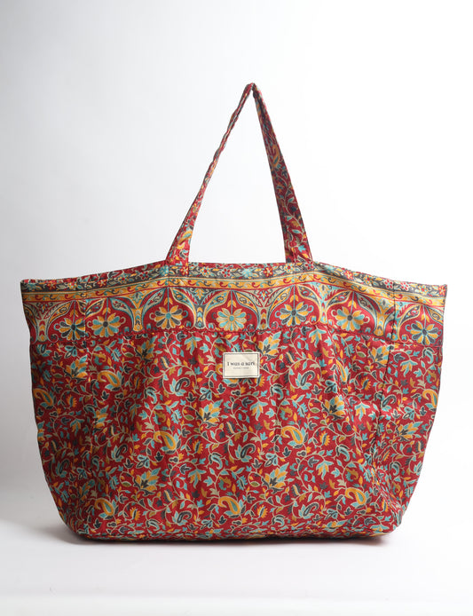 Large beach bag with a spacious rectangular design, wide top opening, and comfortable shoulder handles for carrying daily and travel essentials.