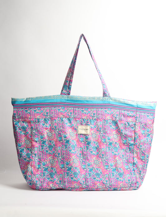 Large beach bag with a spacious rectangular design, wide top opening, and comfortable shoulder handles for carrying daily and travel essentials.
