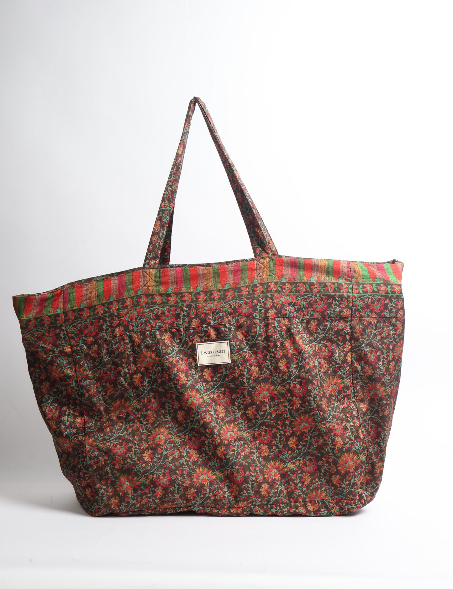 Large beach bag with a spacious rectangular design, wide top opening, and comfortable shoulder handles for carrying daily and travel essentials.