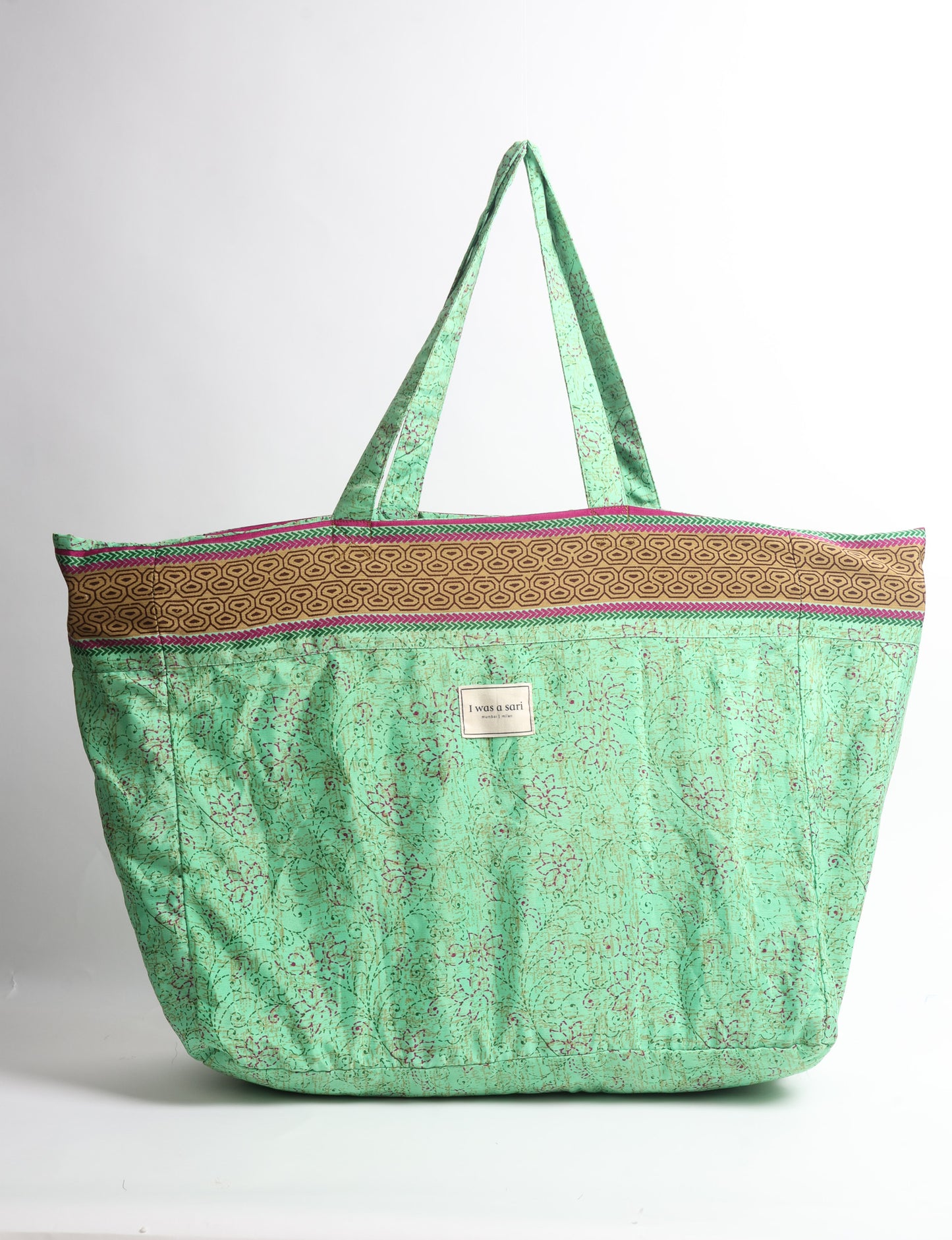 Large beach bag with a spacious rectangular design, wide top opening, and comfortable shoulder handles for carrying daily and travel essentials.
