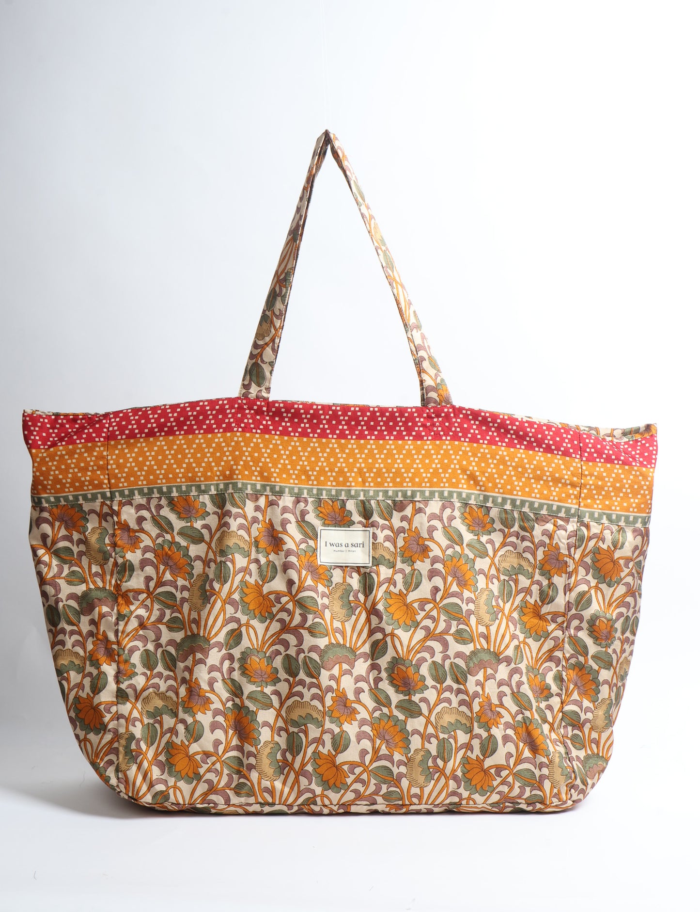 Large beach bag with a spacious rectangular design, wide top opening, and comfortable shoulder handles for carrying daily and travel essentials.