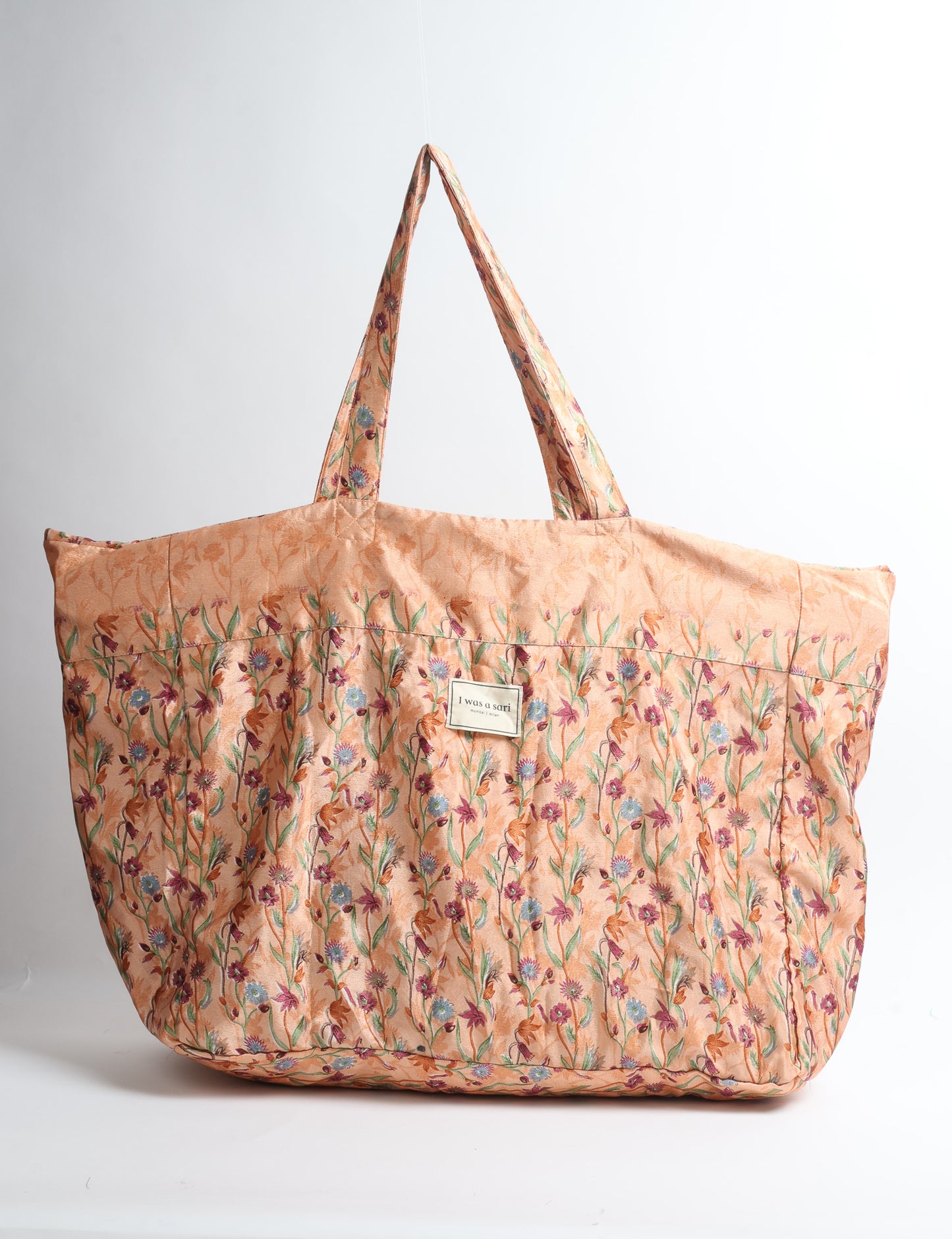 Large beach bag with a spacious rectangular design, wide top opening, and comfortable shoulder handles for carrying daily and travel essentials.