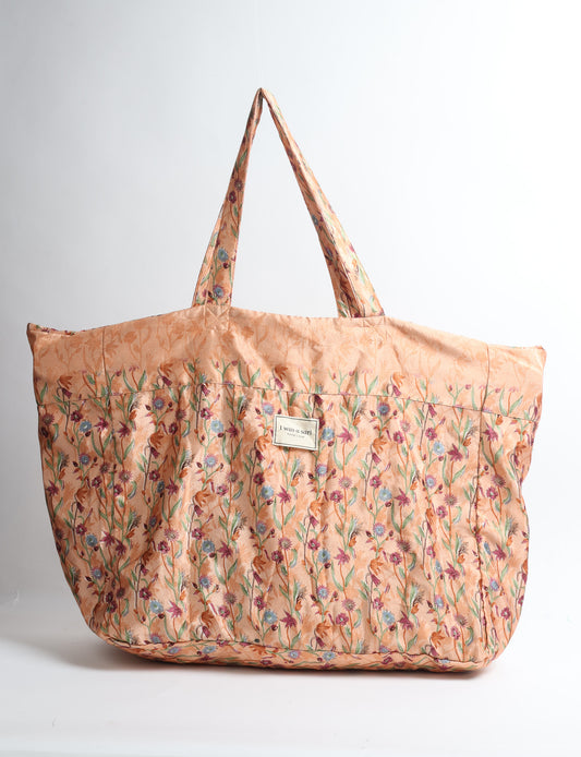 Large beach bag with a spacious rectangular design, wide top opening, and comfortable shoulder handles for carrying daily and travel essentials.