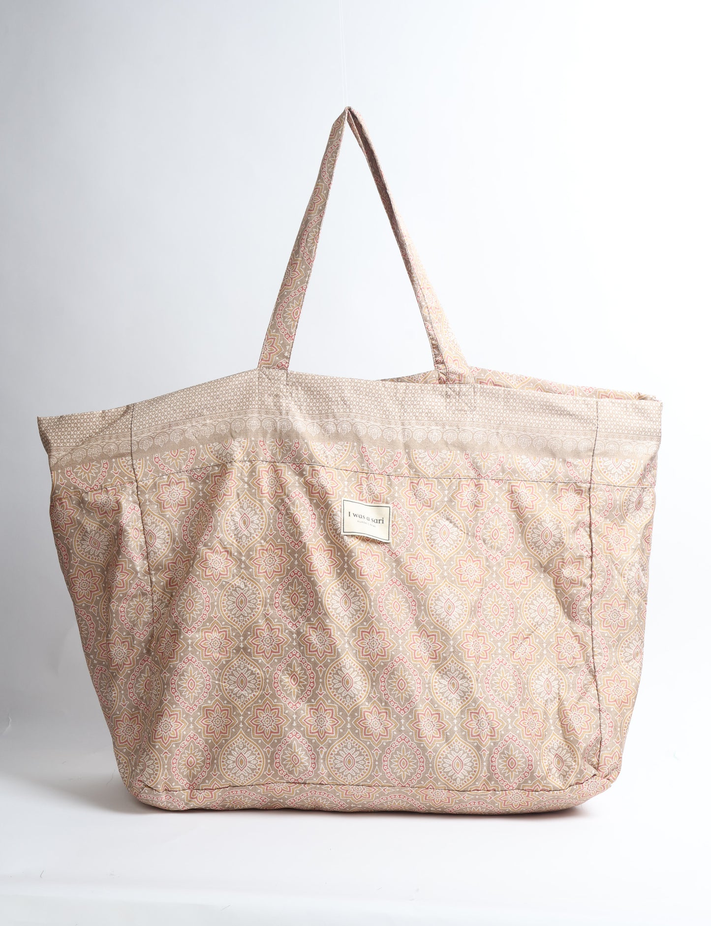 Large beach bag with a spacious rectangular design, wide top opening, and comfortable shoulder handles for carrying daily and travel essentials.