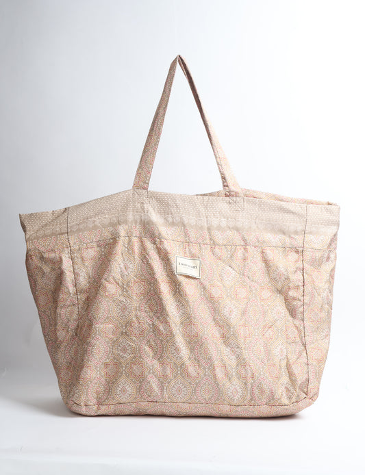 Large beach bag with a spacious rectangular design, wide top opening, and comfortable shoulder handles for carrying daily and travel essentials.