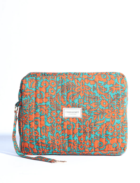 Quilted sling bag with adjustable strap, front zip pocket, and curved silhouette for everyday use