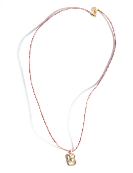 Adjustable cord necklace with gold-plated metal pendant inspired by upcycled women’s clothing, sustainable women’s clothing, eco friendly fashion, recycled sustainable fashion, carbon neutral fashion, and environment friendly clothing principles.