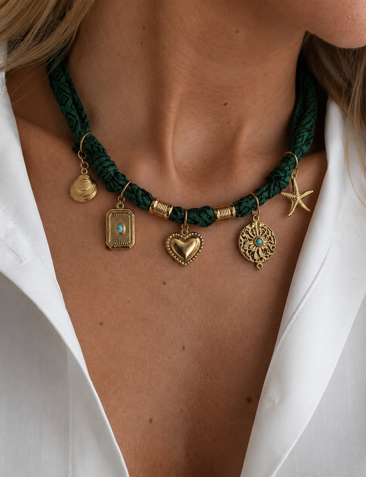 Bandana necklace with gold-plated charms, adjustable tie-back design, stainless steel hardware, handmade statement necklace, sustainable fashion accessory.