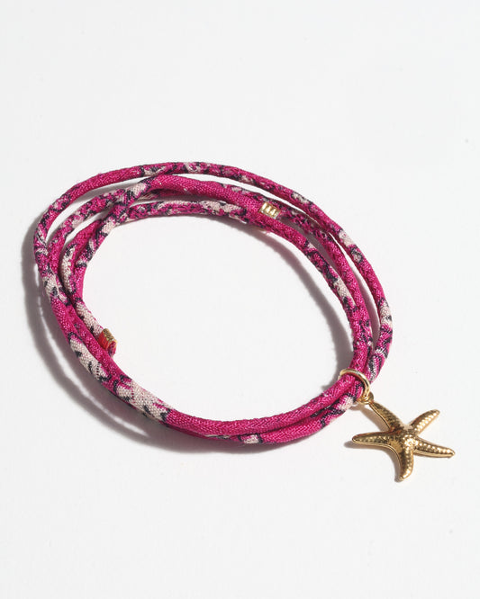 Slim adjustable cord bracelet with gold-plated stainless steel star fish charm inspired by upcycled women’s clothing, sustainable women’s clothing, eco friendly clothes, recycled sustainable fashion, carbon neutral clothing, and environment friendly clothing values.