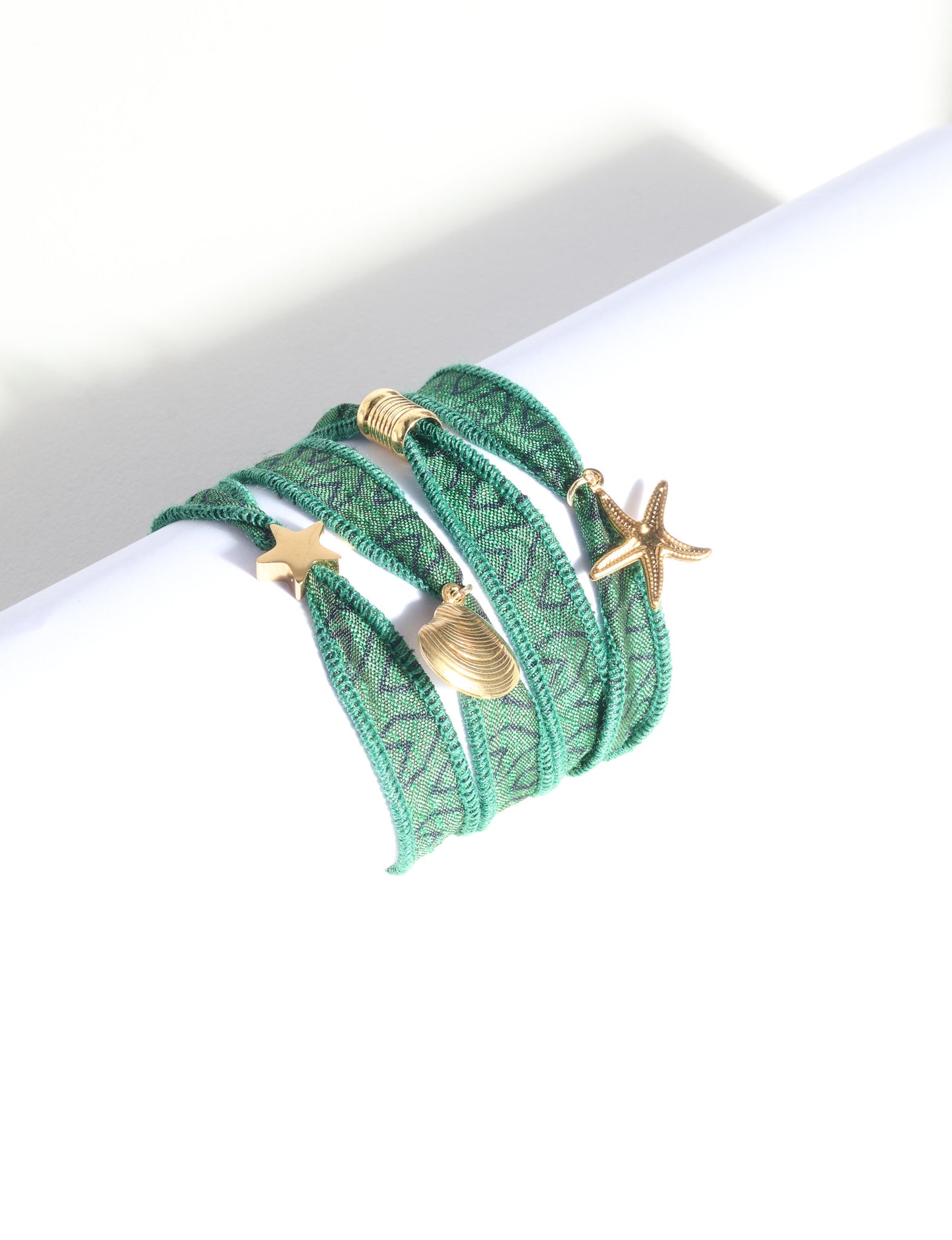 Wrap around bracelet with stainless steel 18K gold-plated charms, adjustable layered bracelet for everyday wear.