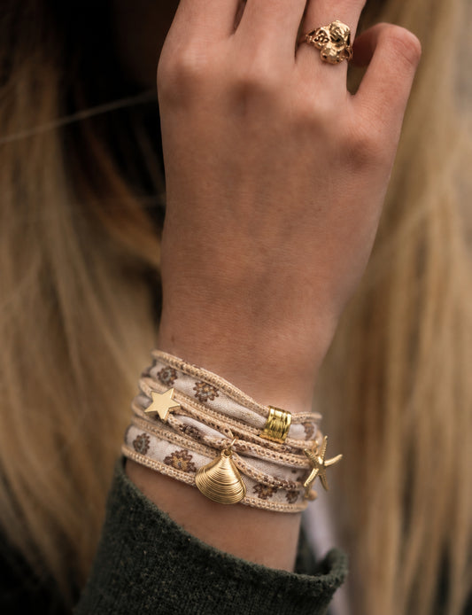 Wrap around bracelet with stainless steel 18K gold-plated charms, adjustable layered bracelet for everyday wear.