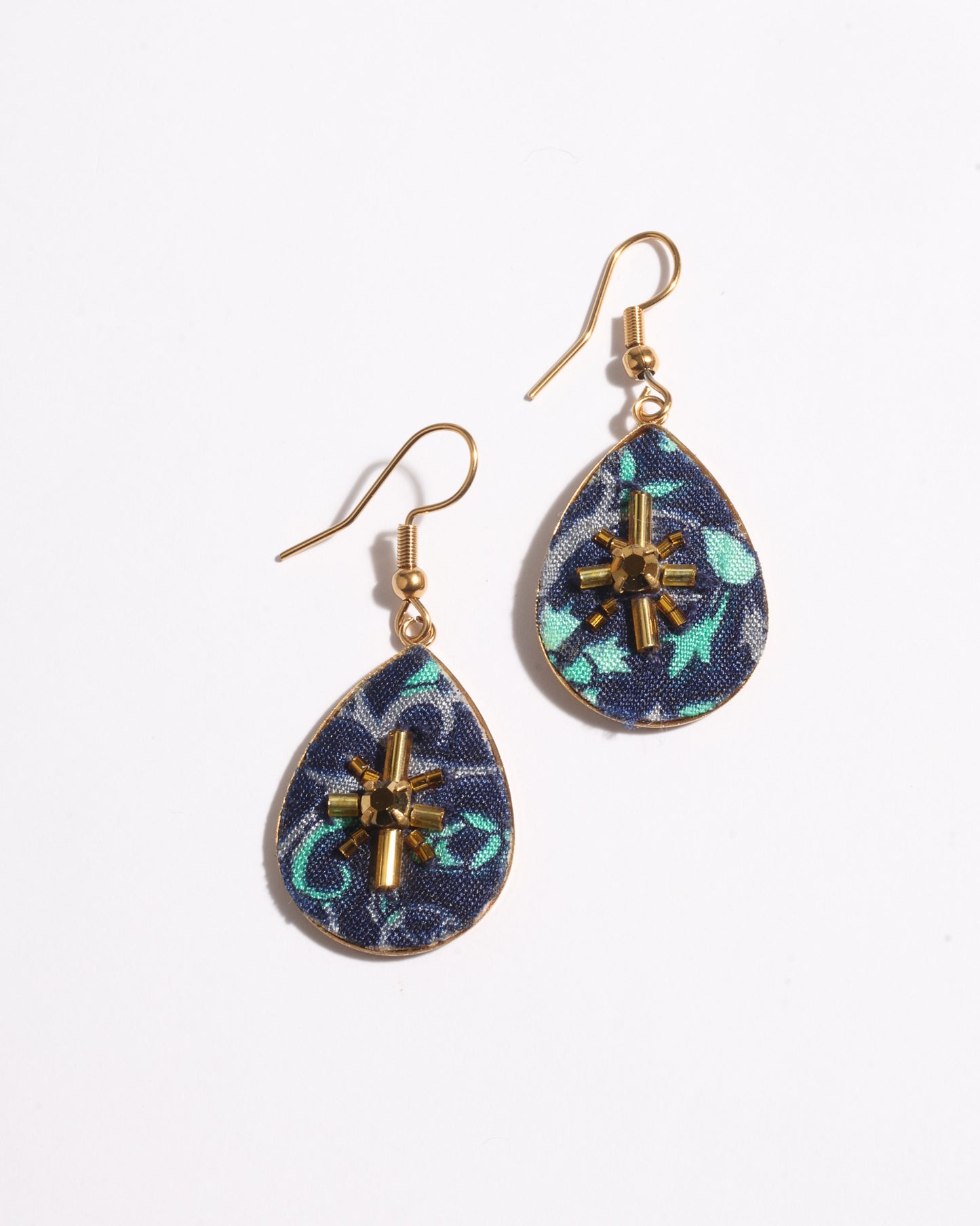 Teardrop embroidery drop earrings inspired by upcycled women’s clothing, sustainable women’s clothing, eco friendly clothes, recycled sustainable fashion, carbon neutral fashion, and environment friendly clothing principles.