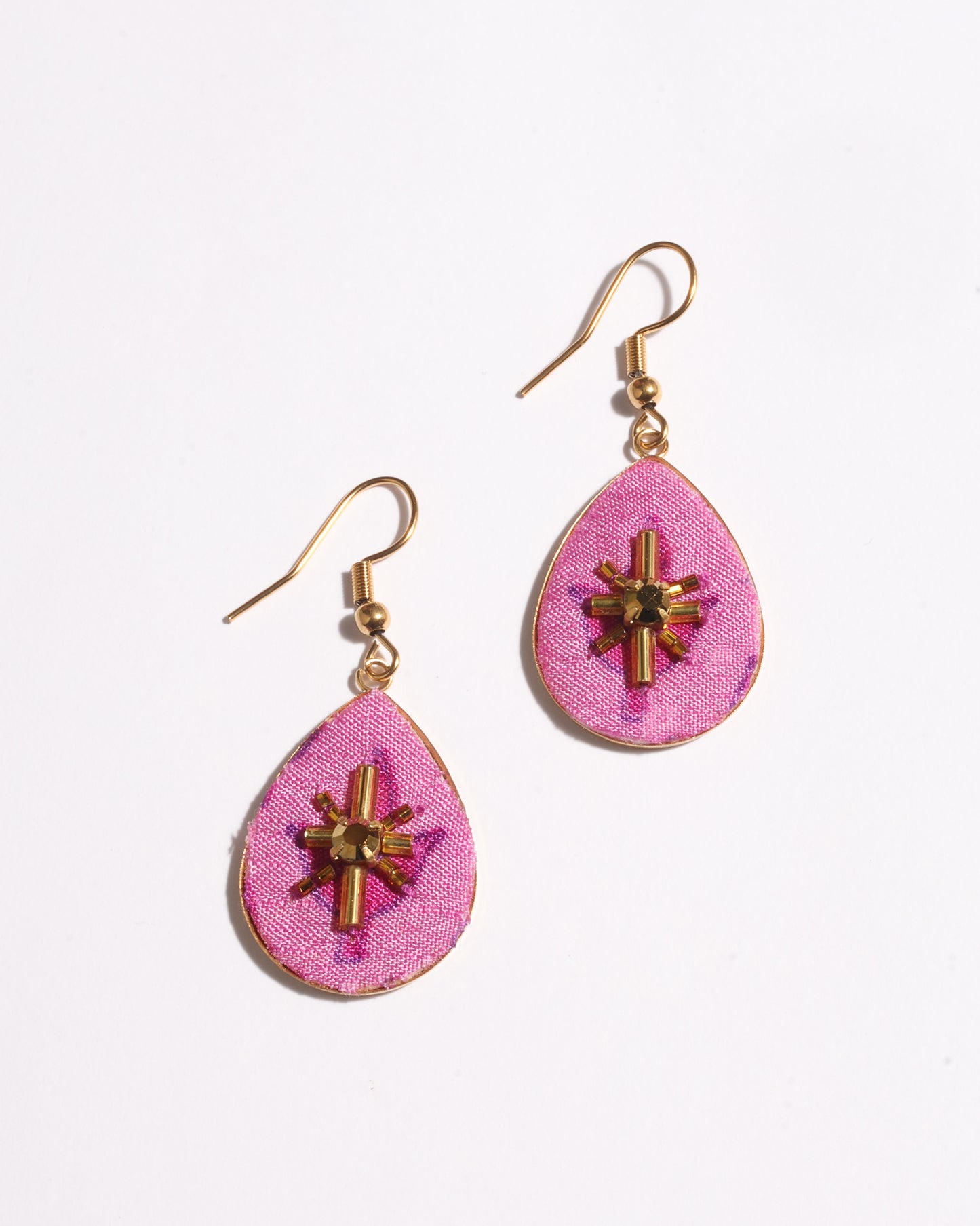 Teardrop embroidery drop earrings inspired by upcycled women’s clothing, sustainable women’s clothing, eco friendly clothes, recycled sustainable fashion, carbon neutral fashion, and environment friendly clothing principles.
