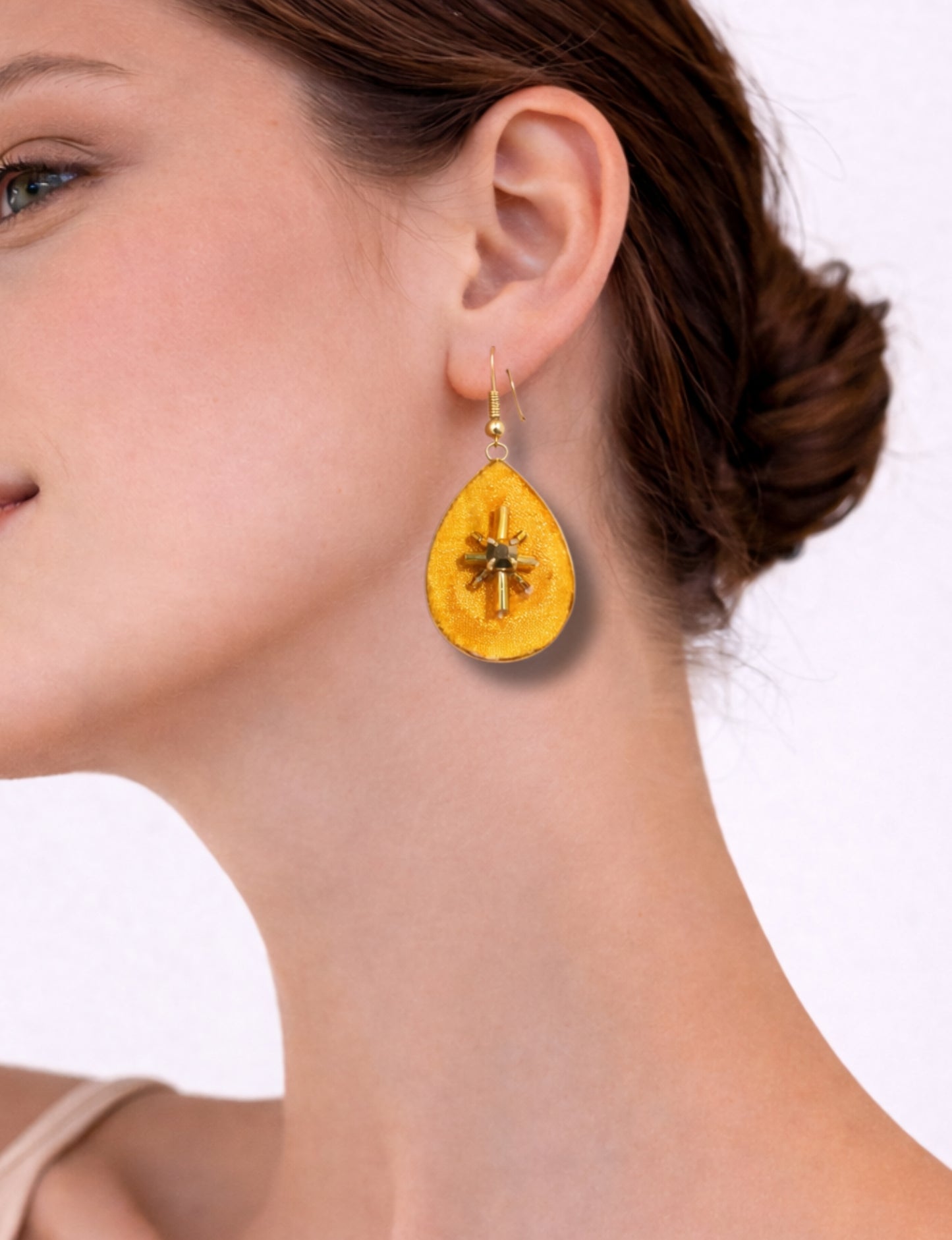 Teardrop embroidery drop earrings inspired by upcycled women’s clothing, sustainable women’s clothing, eco friendly clothes, recycled sustainable fashion, carbon neutral fashion, and environment friendly clothing principles.