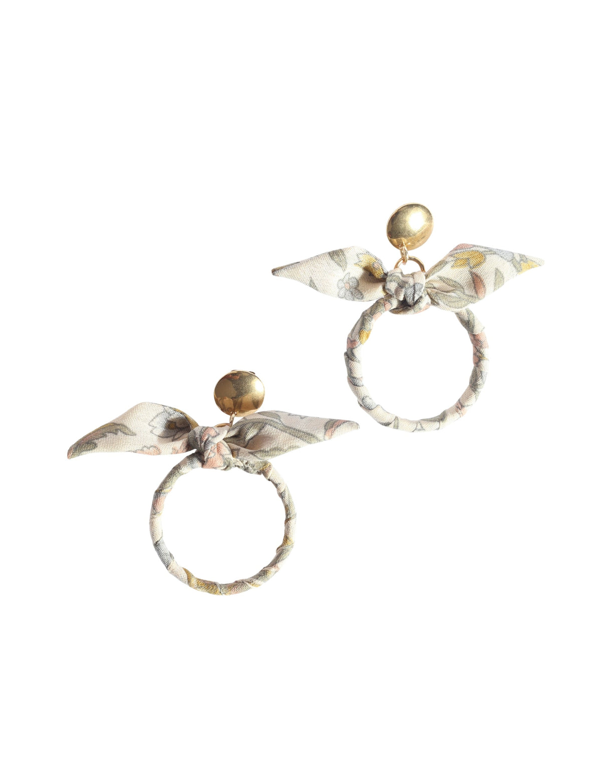 Beige tropical bow earrings with gold-tone round studs and fabric-wrapped circular hoops with floral print bows