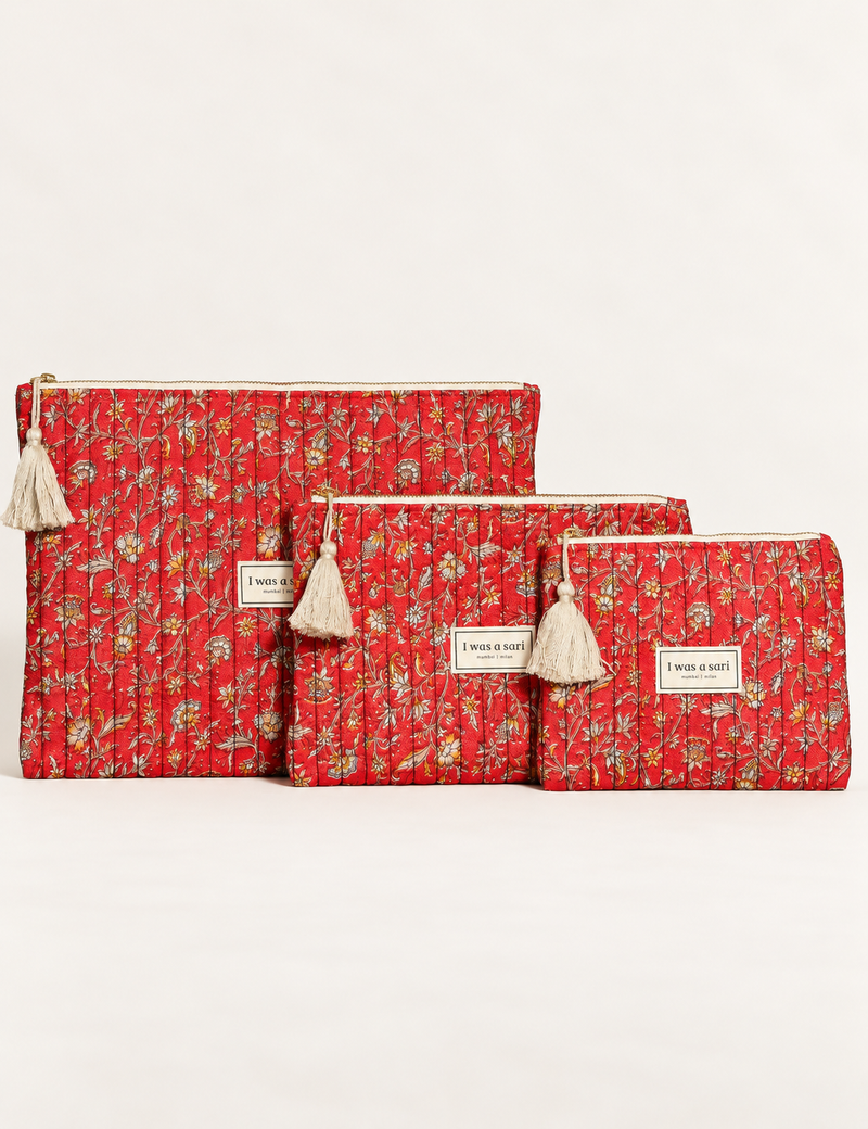 Quilted zipper pouch with tassel trim, available in three sizes for organising everyday essentials.